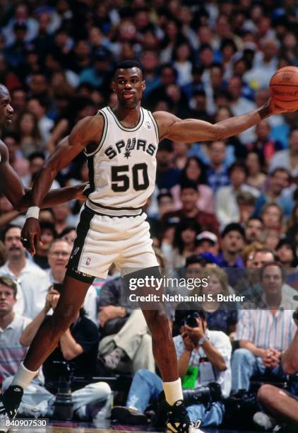 David Robinson of the San Antonio Spurs handles the ball against the Orlando Magic circa 1994 at the Alamo Dome in San San Antonio, Texas. NOTE TO...