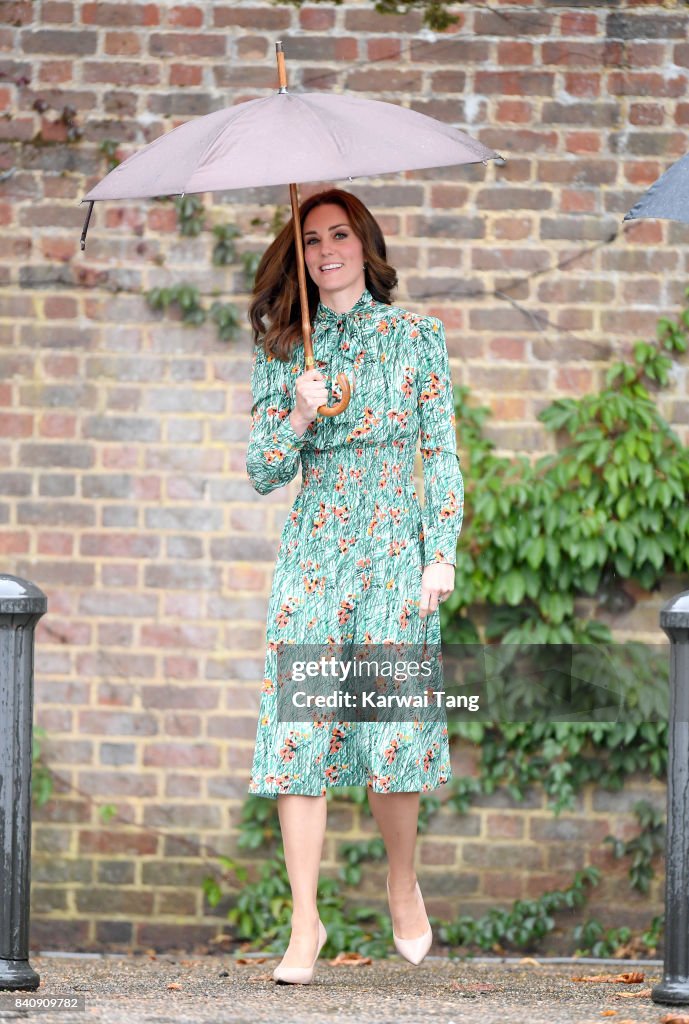 The Duke And Duchess Of Cambridge And Prince Harry Visit The White Garden In Kensington Palace