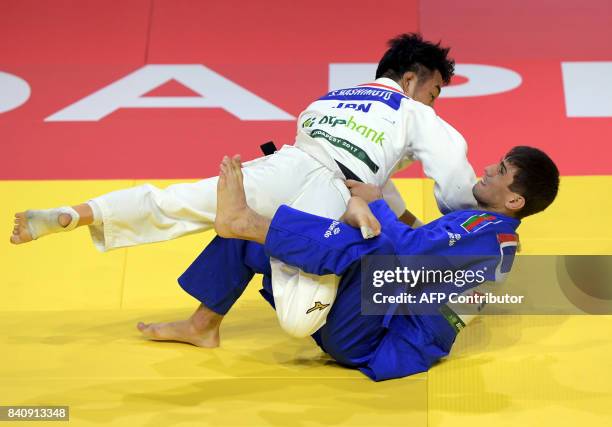 Gold medalist Japan's Soichi Hashimoto competes with Azerbaian's Rustam Orujov during their final in the mens -73kg category at the World Judo...