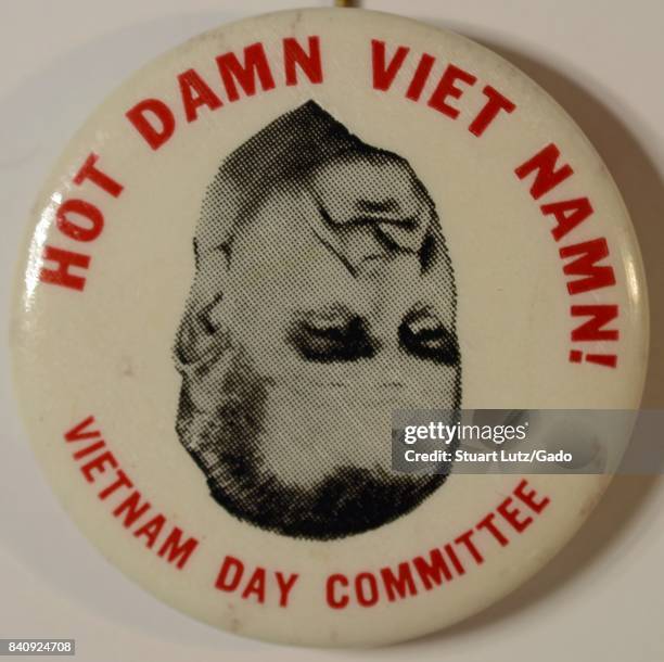 Pinback button from the Vietnam Day Committee with upside down image of United States President Lyndon Johnson, with text reading "Hot Damn Viet...