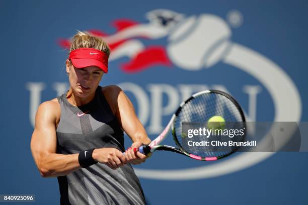 Eugenie Bouchard of Canada returns a shot to Evgeniya Rodina of Russia during their first round Women's Singles match on Day Three of the 2017 US...