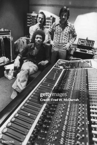 Portriat of American musician Jimi Hendrix , South African-born American music producer and engineer Eddie Kramer and studio manager Jim Marron as...