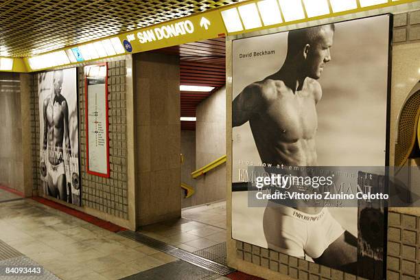 Posters featuring David Beckham modeling underwear in the latest Emporio Armani campaign adorn the walls of the underground on December 19, 2008 in...