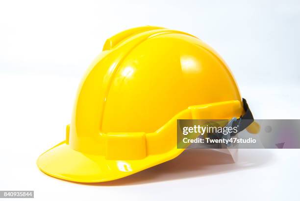 yellow safety helmet on white background - construction worker isolated stock pictures, royalty-free photos & images