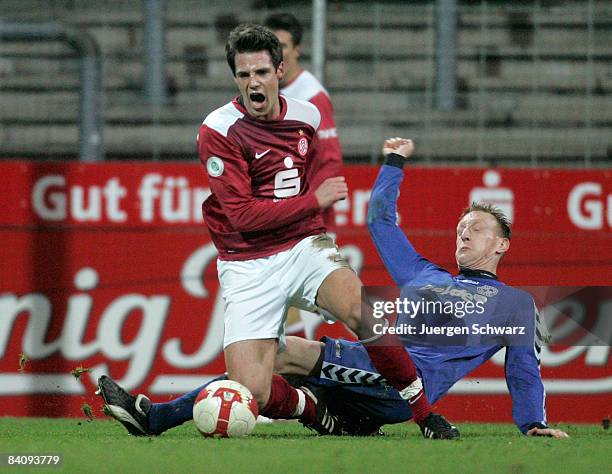 Marcel Stiepermann of Essen and Stefan Zepanski of Lotte battle for the ball during the Regional Liga match between Rot-Weiss Essen and Sportfreunde...