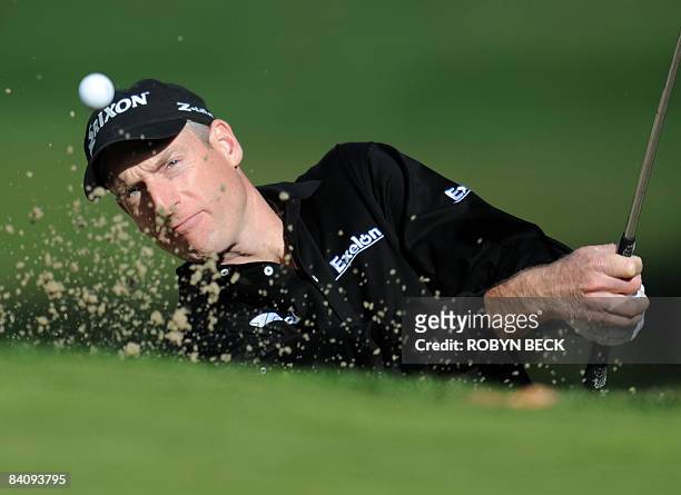 Jim Furyk of the US hits out of a bunker on the 5th, in the second round of the Chevron World Challenge, at the Sherwood Country Cub in Thousand...