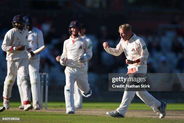 Matt Parkinson of Lancashire celebrates after getting Keith Barker of Warwickshire out during the County Championship Division One match between...