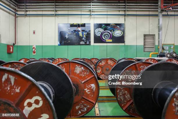 Metal spools used to wind material for automobile tire assembly sit at the Pirelli & Co. SpA production plant in Merlo, Buenos Aires Province,...