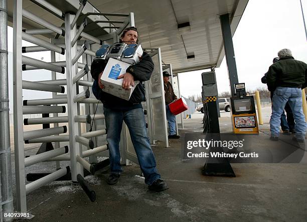 Worker leaves a Chrysler manufacturing plant December 19, 2008 in Fenton, Missouri. Chrysler announced plans to idle North American manufacturing...