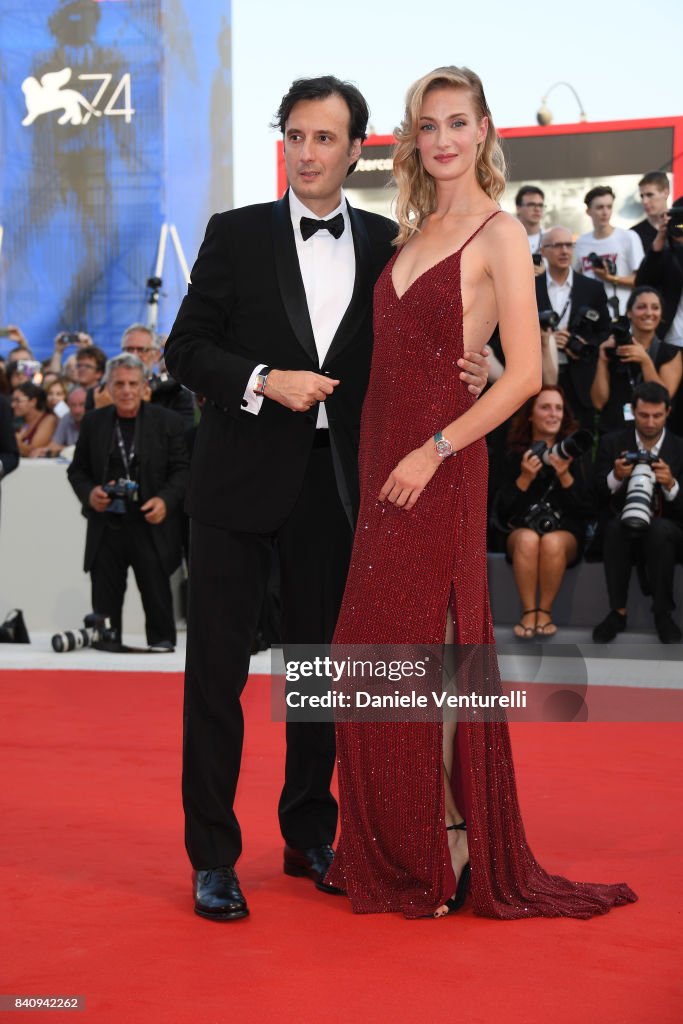Eva Riccobono and Matteo Ceccarini walk the red carpet ahead of the