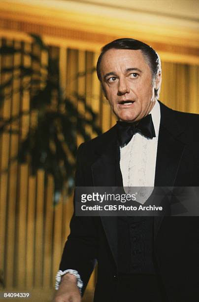 Dapper Robert Vaughn, as Napoleon Solo, carries out a mission while dressed in a tuxedo, from the television spy series 'The Man From U.N.C.L.E.,...