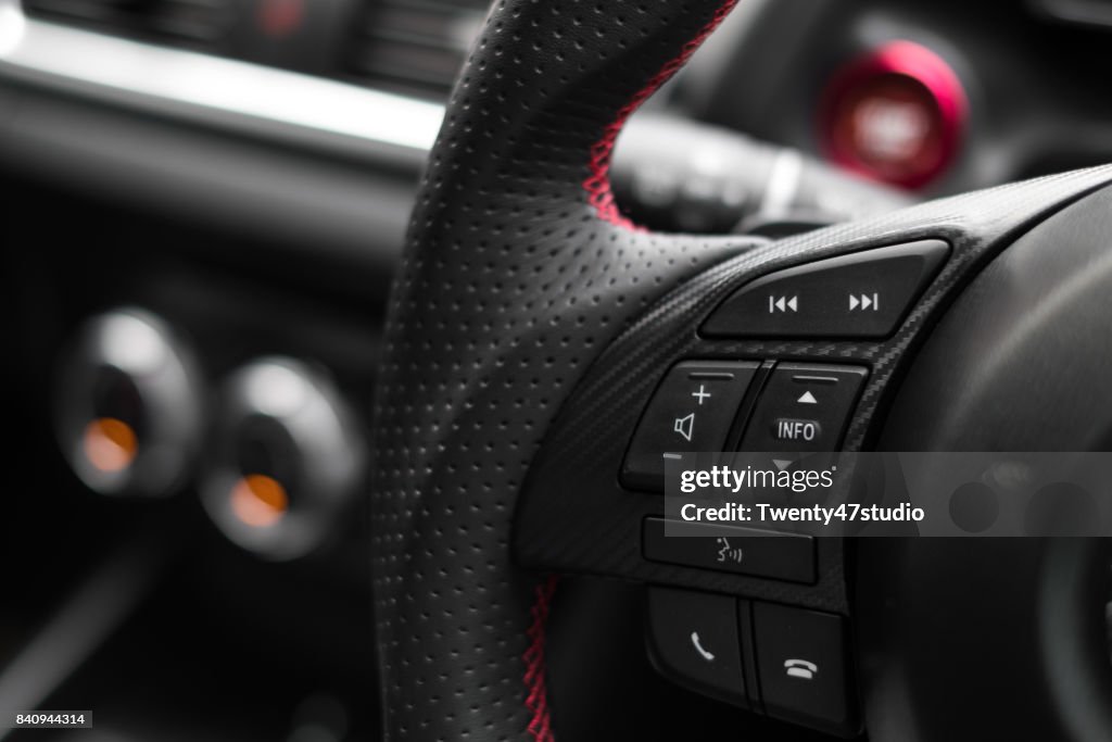 Control buttons on steering wheel in a modern car