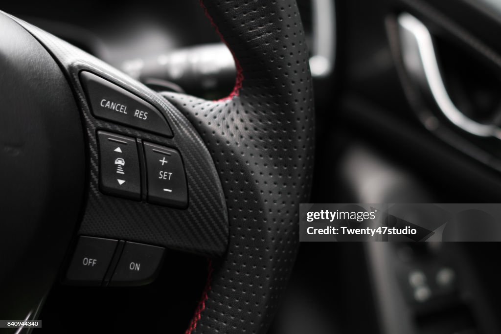 Control buttons on steering wheel in a modern car