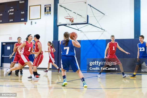 high school co-ed basketball game - high school basketball stock pictures, royalty-free photos & images