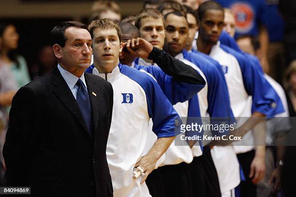 Head coach Mike Krzyzewski of the Duke Blue Devils stands with the team before the game against the North Carolina Asheville Bulldogs on December 17,...