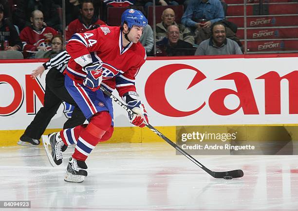 Roman Hamrlik of the Montreal Canadiens skates up ice with the puck against the Calgary Flames at the Bell Centre on December 9, 2008 in Montreal,...