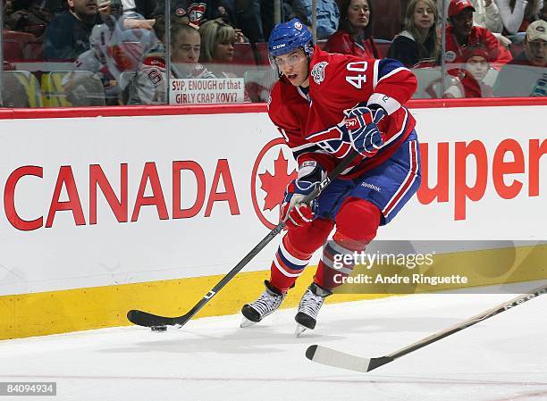 Maxim Lapierre of the Montreal Canadiens stickhandles the puck against the Calgary Flames at the Bell Centre on December 9, 2008 in Montreal, Quebec,...