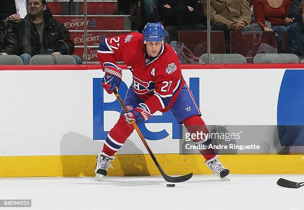 Alexei Kovalev of the Montreal Canadiens controls the puck against the Calgary Flames at the Bell Centre on December 9, 2008 in Montreal, Quebec,...