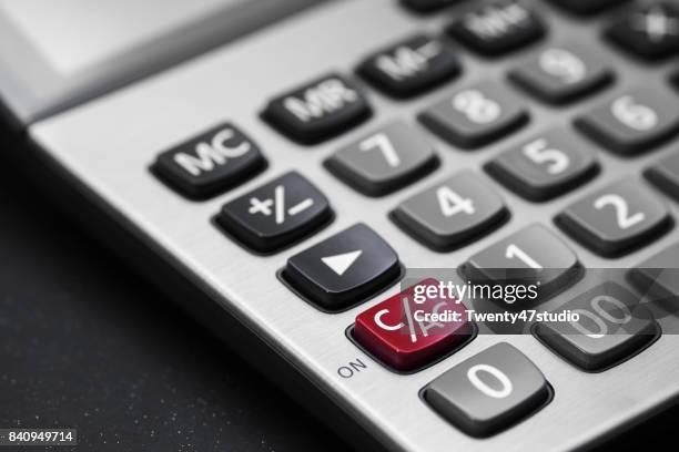 calculator on black and white on c/ac button is red color - calculator buttons stock pictures, royalty-free photos & images