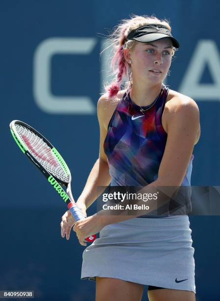Ashley Kratzer of the United States returns a shot to Tatjana Maria of Germany during their first round Women's Singles match on Day Three of the...