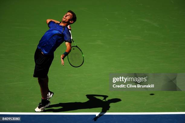 Henri Laaksonen of Switzerland serves to Juan Martin del Potro of Argentina during their first round Men's Singles match on Day Three of the 2017 US...