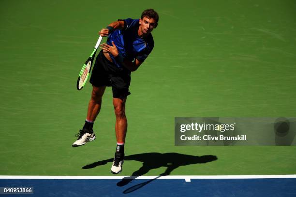 Henri Laaksonen of Switzerland serves to Juan Martin del Potro of Argentina during their first round Men's Singles match on Day Three of the 2017 US...