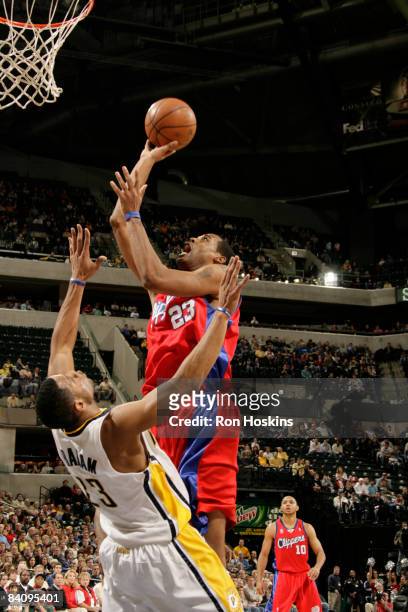 Marcus Camby of the L.A. Clippers shoots over Stephen Graham of the Indiana Pacers at Conseco Fieldhouse on December 19, 2008 in Indianapolis,...