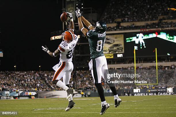 Defensive back Brandon McDonald of the Cleveland Browns intercepts a pass intended for wide receiver Hank Baskett of the Philadelphia Eagles during a...
