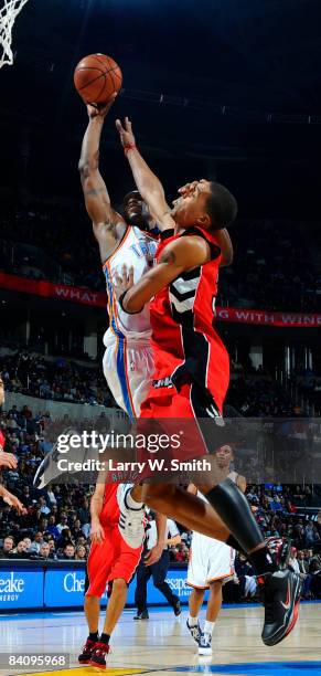 Desmond Mason of the Oklahoma City Thunder goes to the basket against Jamario Moon of the Toronto Raptors at the Ford Center on December 19, 2008 in...