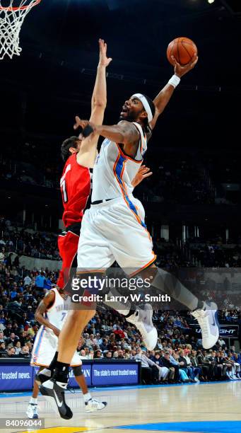 Chris Wilcox of the Oklahoma City Thunder goes up for a slam dunk against Andrea Bargnani of the Toronto Raptors at the Ford Center on December 19,...