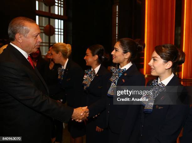 Turkish President Recep Tayyip Erdogan salutes citizens during a reception for the 95th Anniversary of Turkeys Victory Day at the Presidential...