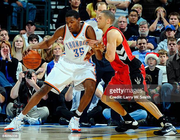 Kevin Durant of the Oklahoma City Thunder goes to the basket against Anthony Parker of the Toronto Raptors at the Ford Center on December 19, 2008 in...