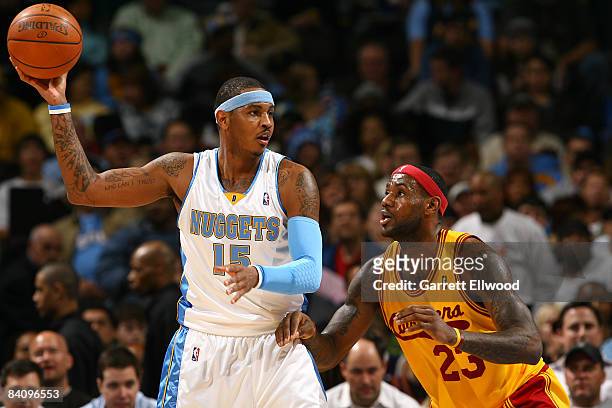 Carmelo Anthony of the Denver Nuggets looks to pass against Lebron James of the Cleveland Cavaliers on December 19, 2008 at the Pepsi Center in...
