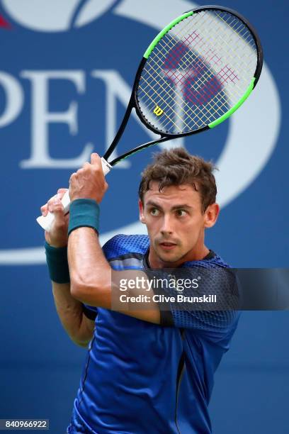 Henri Laaksonen of Switzerland returns a shot to Juan Martin del Potro of Argentina during their first round Men's Singles match on Day Three of the...