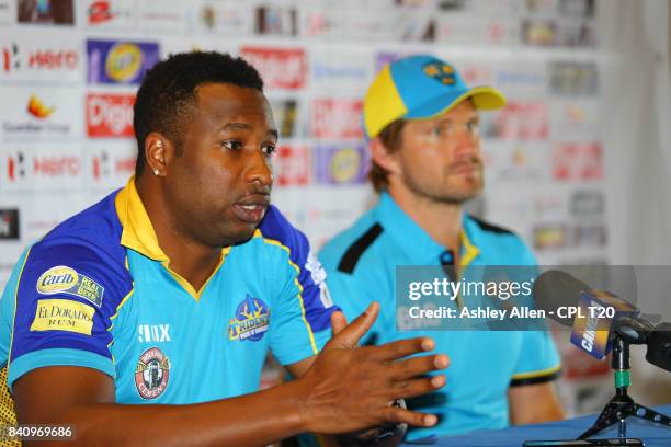 In this handout image provided by CPL T20, Captains Kieron Pollard of Barbados Tridents and Shane Watson of the Saint Lucia Stars during the...