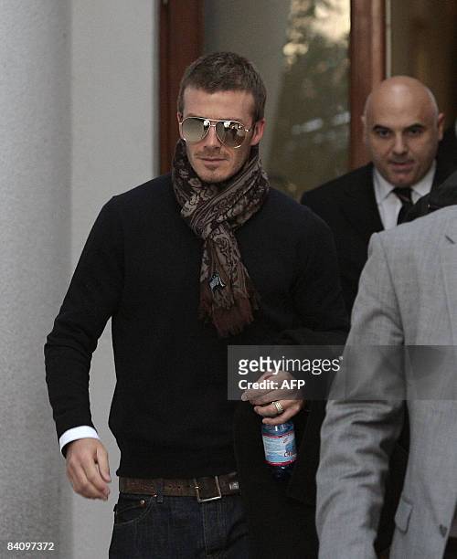 Former England football team captain David Beckham leaves a private clinic in Appiano Gentile near Como on December 20, 2008. Beckham will be...