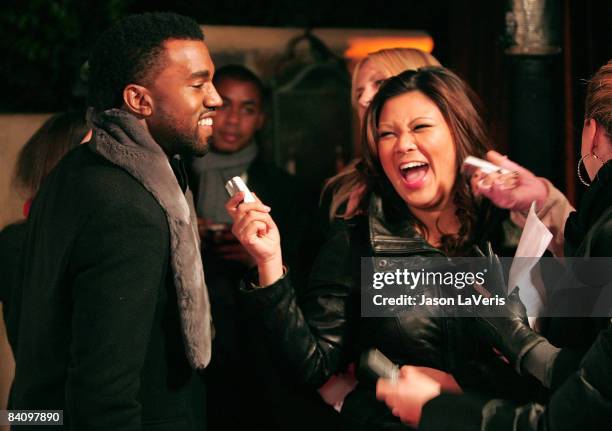 Rapper Kanye West speaks to reporters at Flaunt Magazine's 10th anniversary and annual holiday toy drive at The Wayne Kao Mansion on December 18,...