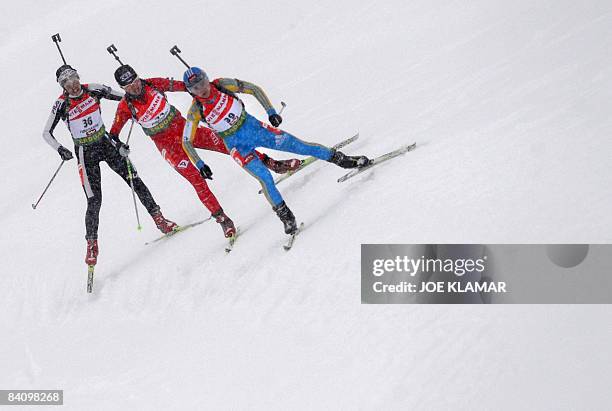 Italy's Michaela Ponza, Czech's Zdenka Vejnarova and Ukraine's Vita Semerenko compete in women's 7.5 km sprint during biathlon World Cup in...