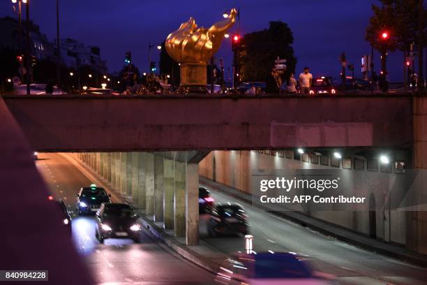 Cars drive on August 30, 2017 under the Alma bridge under the Flame of Liberty monument - which became an unofficial memorial for Diana, Princess of...