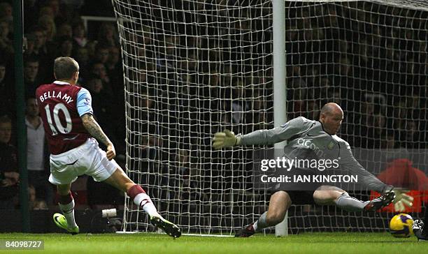 Aston Villa's US Goalkeper Brad Friedel saves a shot by West Ham United's Craig Bellamy during a Premiership football match at Upton Park in London,...