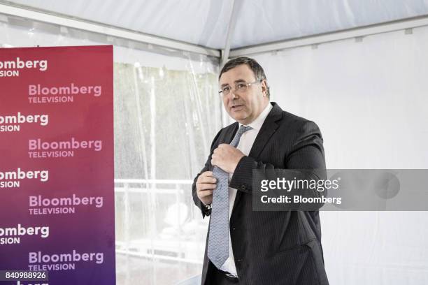 Patrick Pouyanne, chief executive officer of Total SA, speaks during a Bloomberg Television interview at the Medef business conference in...