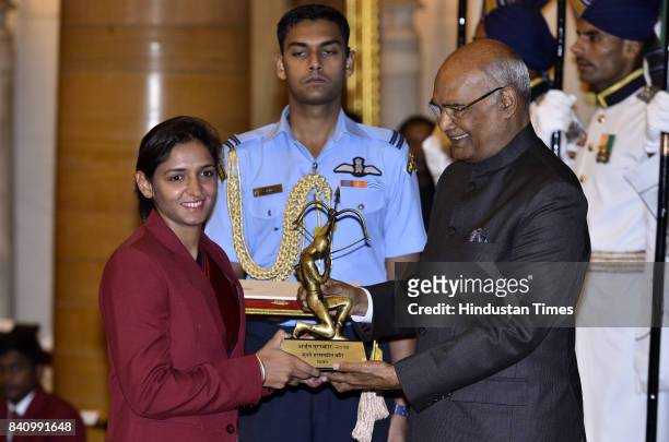 President Ram Nath Kovind confers the Arjuna award to Cricketer Harmanpreet Kaur at a function at Rashtrapati Bhawan here on the occasion of National...