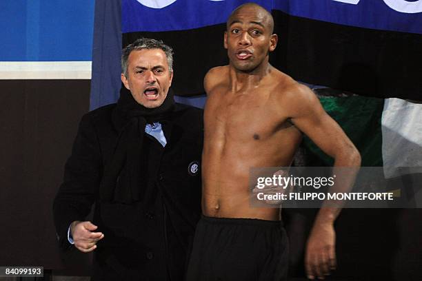 Inter Milan's Brazilian defender Maicon celebrates with Portuguese coach Jose Mourinho after scoring against Siena during their Italian Serie A match...