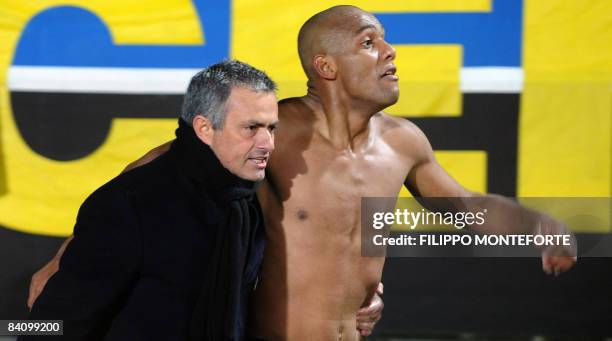 Inter Milan's Brazilian defender Maicon celebrates with Portuguese coach Jose Mourinho after scoring against Siena during their Italian Serie A match...