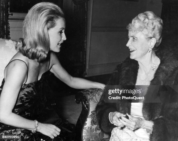 View of American actress and heiress Dina Merrill talks with her mother, socialite Marjorie Merriweather Post , at an unspecified event, Washington...