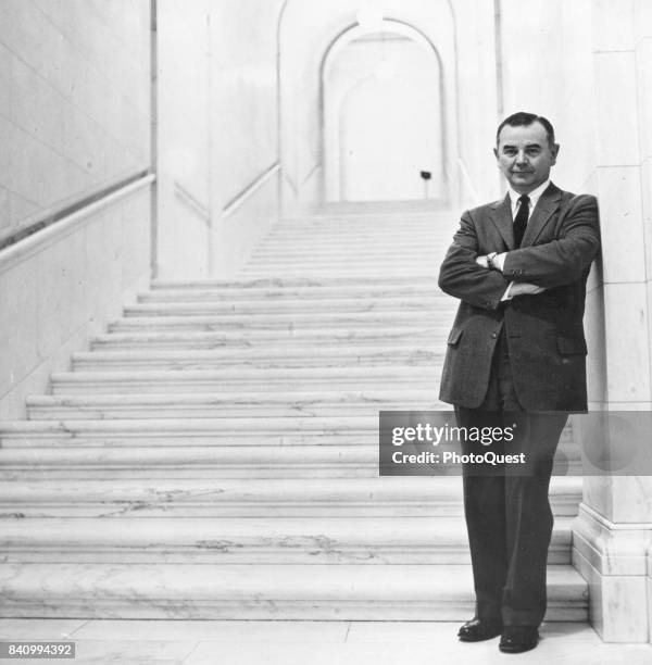 Portrait of American jurist Associate Justice of the US Supreme Court William J Brennan Jr as he poses at the foot of a marble staircase, Washington...