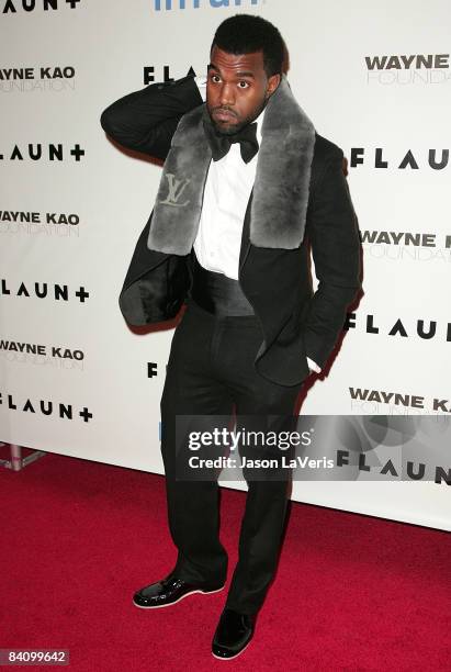 Rapper Kanye West attends Flaunt Magazine's 10th anniversary and annual holiday toy drive at The Wayne Kao Mansion on December 18, 2008 in Los...