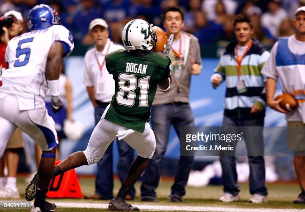 Receiver Dontavia Bogan of the South Florida Bulls catches a pass against the Memphis Tigers during the inaugural St. Petersburg Bowl Game at...