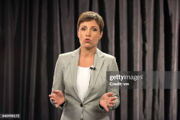 portrait of a female commentator - commentator stock pictures, royalty-free photos & images