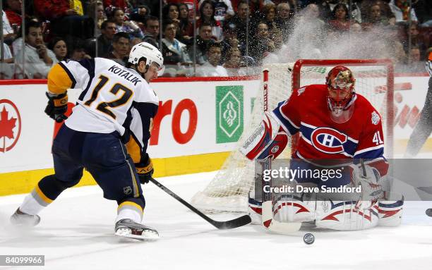 Ales Kotalik of the Buffalo Sabres is stopped on this scoring attempt by Jaroslav Halak of the Montreal Canadiens during their NHL game at the Bell...